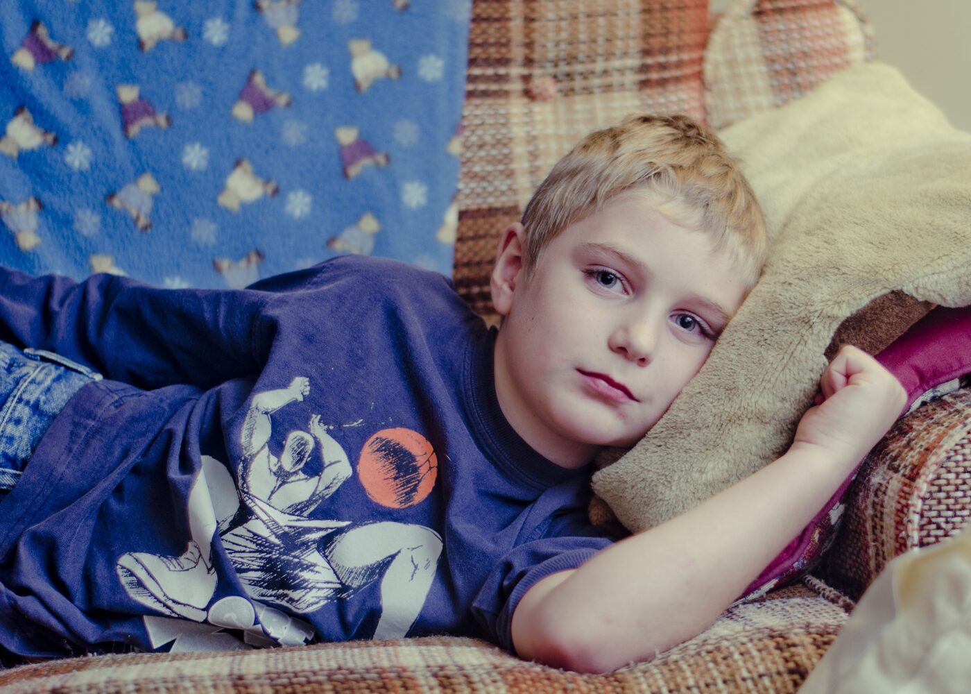 Boy lying on couch