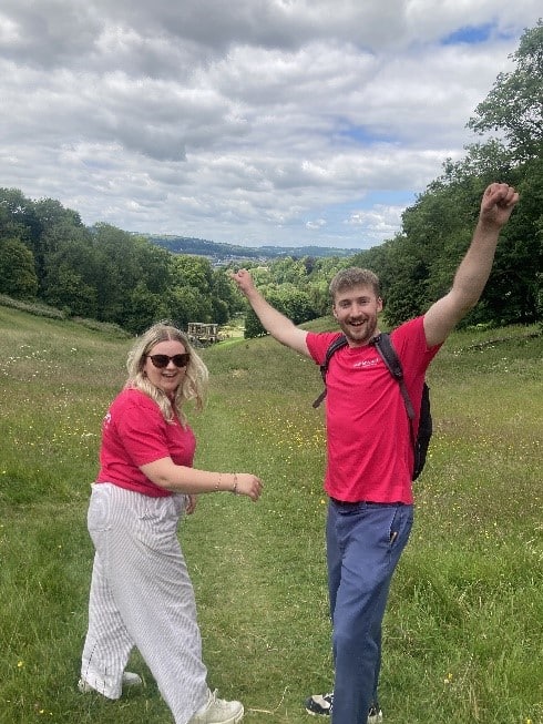 A man and a woman smiling while fundraising for Women's Aid.
