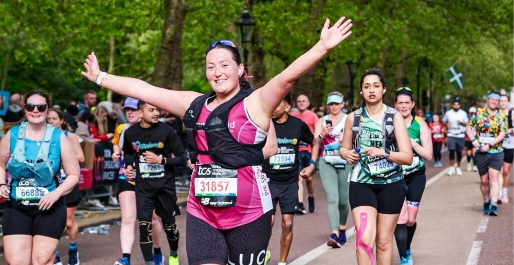 A woman running for Women's Aid at a charity run