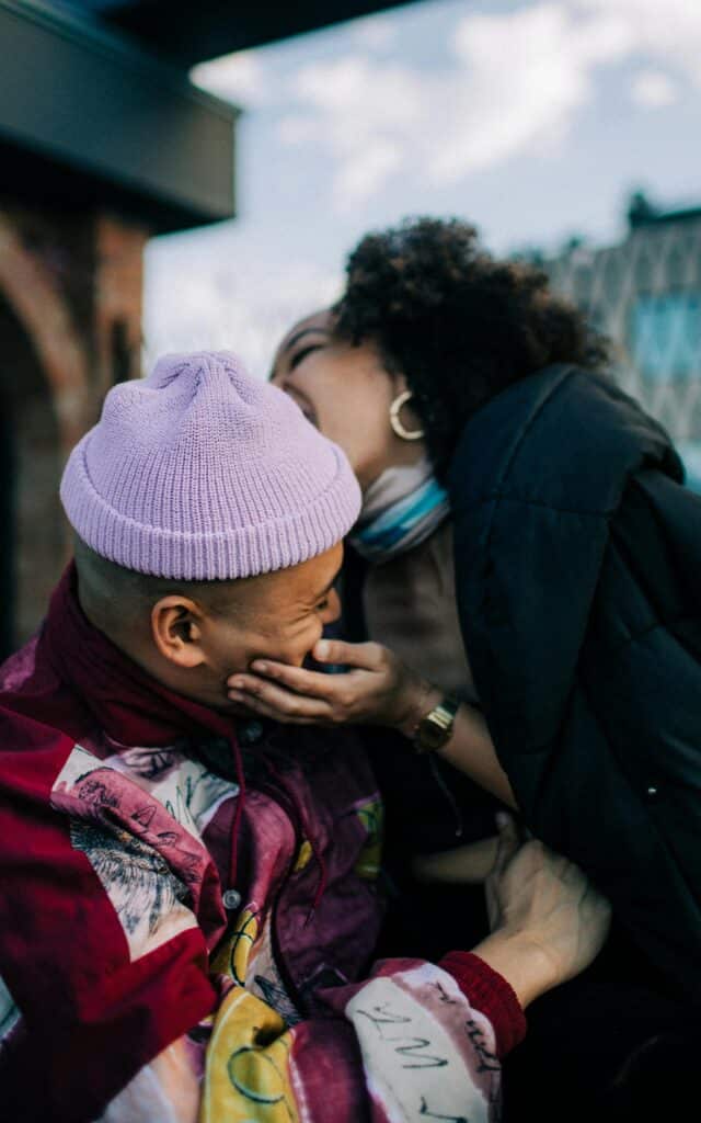 Two young people laughing together