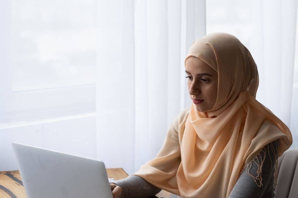 Woman looking at laptop