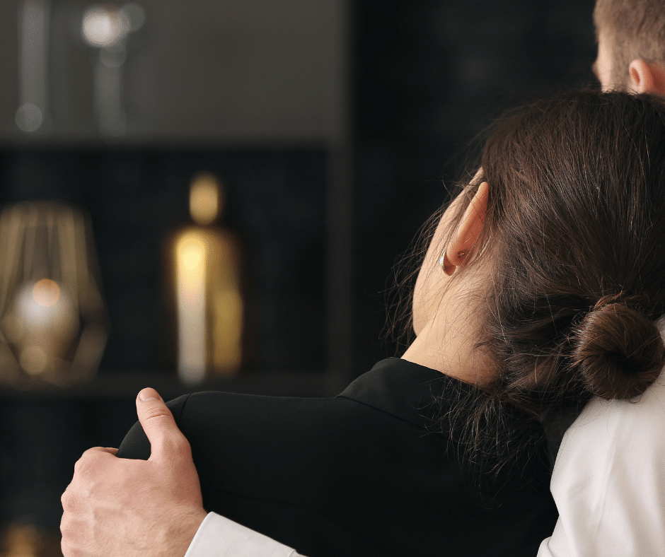 Woman leaning on the shoulder of a man