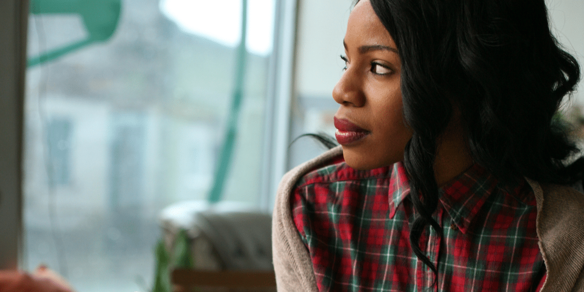 Woman looking out of a window