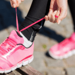 Someone tying their shoes